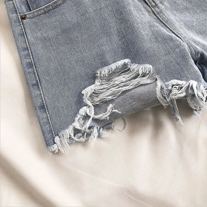 Pocket Tassel Perforated Denim Shorts Female