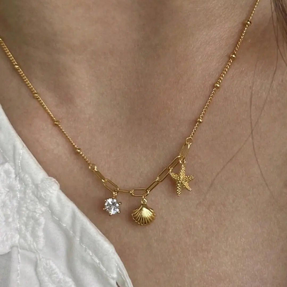 Small starfish shell zircon necklace