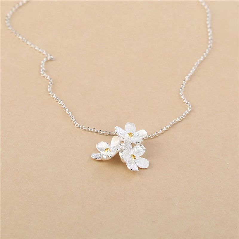 triangle forget me not necklace