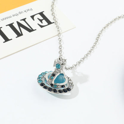 Saturn necklace, teardrop colored diamond earrings, Saturn earrings