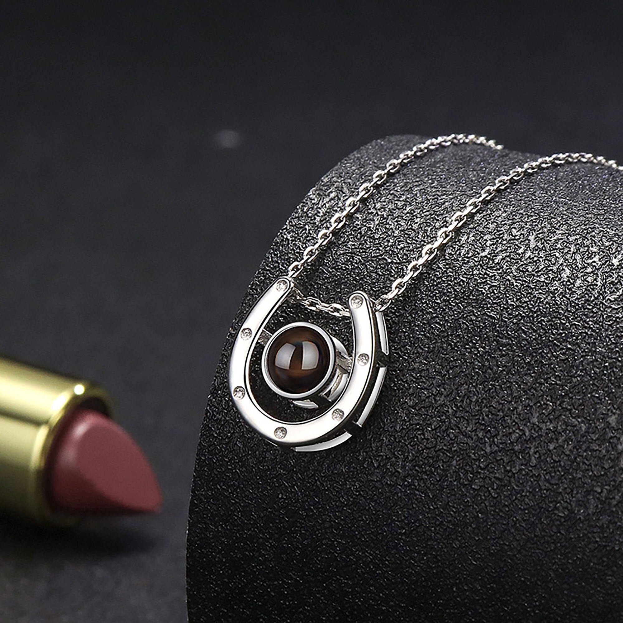 A horseshoe shaped projection necklace with customizable photos Valentine&