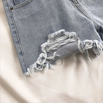 Pocket Tassel Perforated Denim Shorts Female