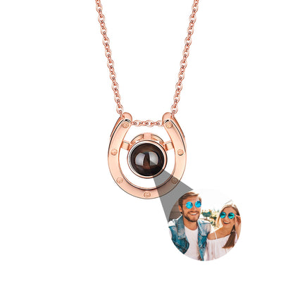 A horseshoe shaped projection necklace with customizable photos Valentine&