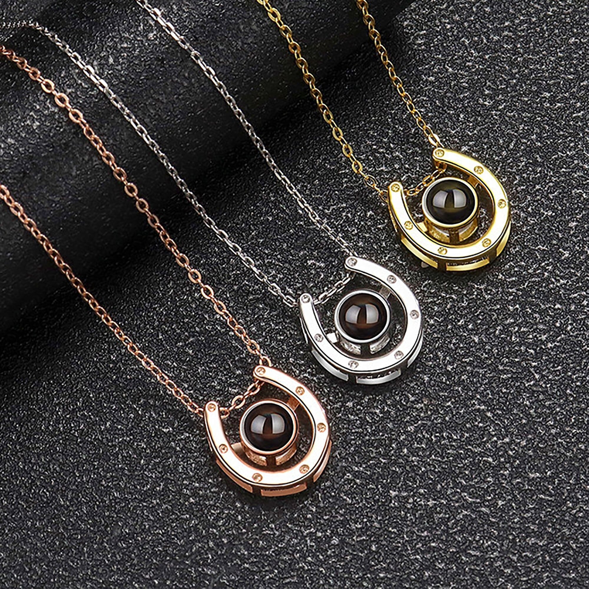 A horseshoe shaped projection necklace with customizable photos Valentine&