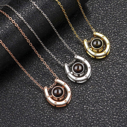 A horseshoe shaped projection necklace with customizable photos Valentine&