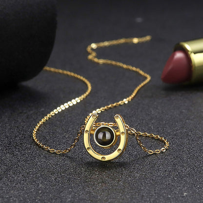 A horseshoe shaped projection necklace with customizable photos Valentine&