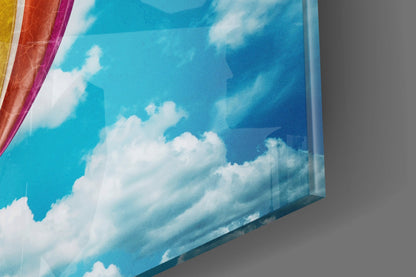Rainbow Balloon in Bright Blue Sky Glass Wall Art